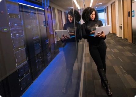 Woman standing with laptop photo